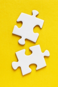 Jig Saw Puzzle - Two Pieces on Yellow